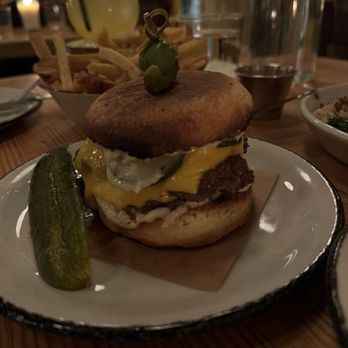 Nancy's Hustle - cheeseburger on a brioche english muffin, american cheese, pickles, red onion - New American Near Me - Houston, Texas Nancy's Hustle - cheeseburger on a brioche english muffin, american cheese, pickles, red onion - New American Near Me - Houston, Texas