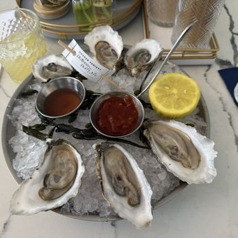 Delaney Oyster House - Seaside Oysters with selection of mignonette sauce and cocktail sauce. Excellent salinity. - Seafood Near Me - Charleston, South Carolina
