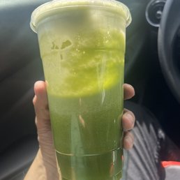 a person holding a drink in a car