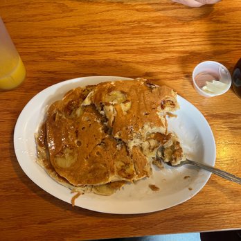 The Blue Cottage - a plate of pancakes and a glass of orange juice - Breakfast & Brunch Near Me - Providence, Rhode Island The Blue Cottage - a plate of pancakes and a glass of orange juice - Breakfast & Brunch Near Me - Providence, Rhode Island