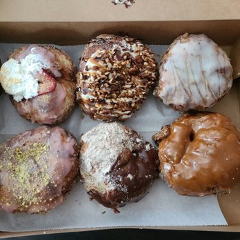 Parlor Doughnuts - Top: Strawberry shortcake, turtle cheesecake, honey glazed Bottom: raspberry pistachio, churro, bourbon caramel - Donuts Near Me - Oceanside, California Parlor Doughnuts - Top: Strawberry shortcake, turtle cheesecake, honey glazed Bottom: raspberry pistachio, churro, bourbon caramel - Donuts Near Me - Oceanside, California