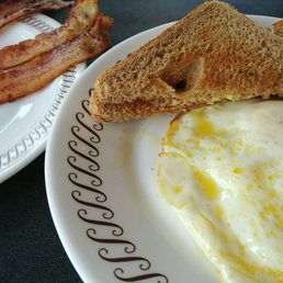 Over easy eggs, toast, bacon Over easy eggs, toast, bacon