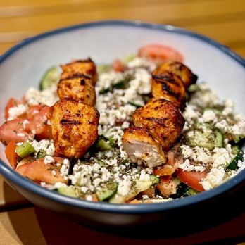 Capo Mediterranean Kitchen - Greek salad with grilled chicken skewers. - Mediterranean Near Me - Belmont, California Capo Mediterranean Kitchen - Greek salad with grilled chicken skewers. - Mediterranean Near Me - Belmont, California