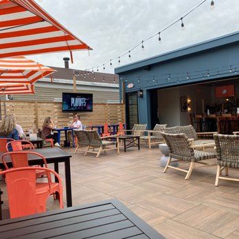 Rusk Kitchen & Bar - Patio with a view of the game - Cocktail Bars Near Me - Cincinnati, Ohio