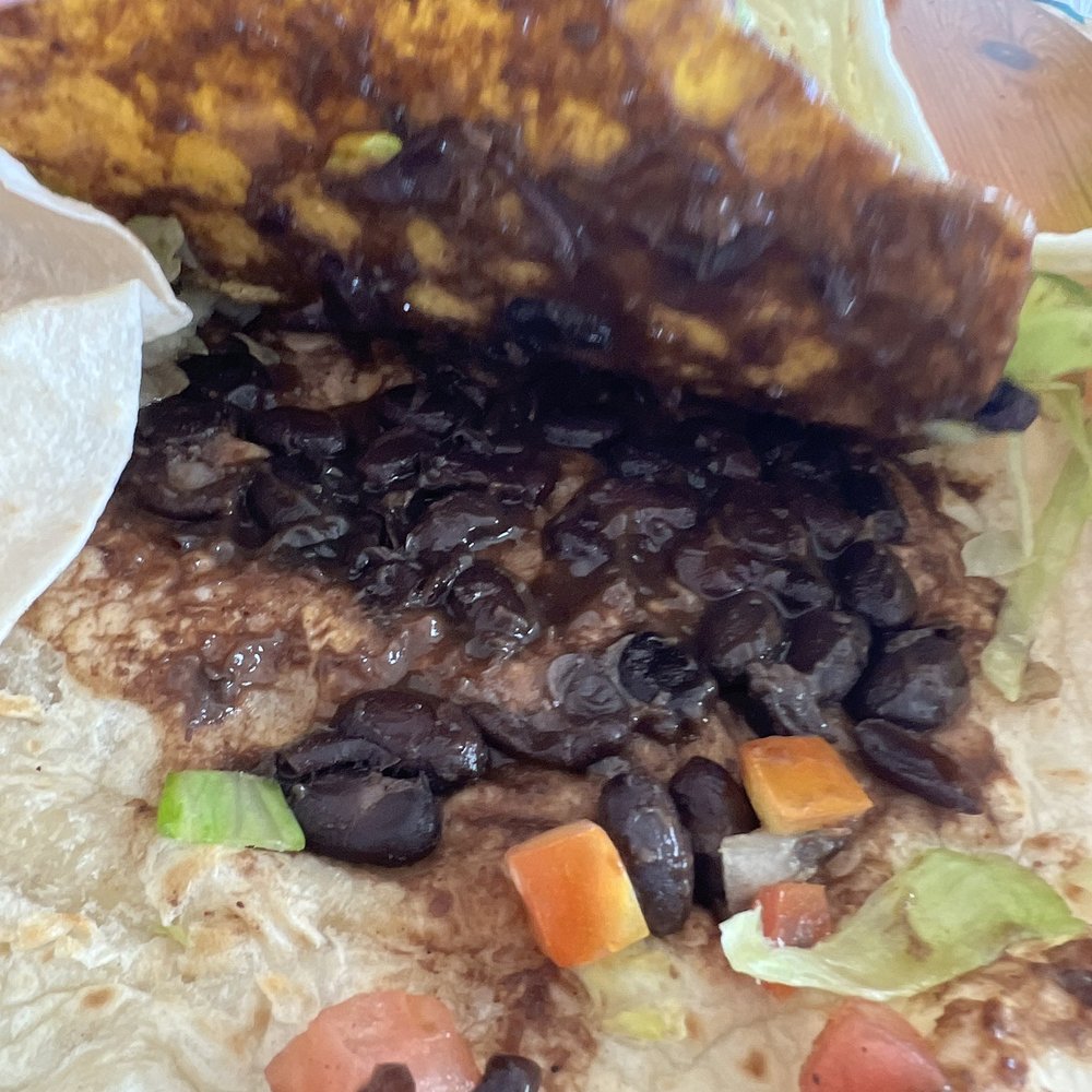 Taco Bell - Live Más Café - The inside of the Crunchwrap. The smallest amount of smushed black beans I've ever seen. I can't get myself to eat this. - Fast Food Near Me - Simi Valley, California Taco Bell - Live Más Café - The inside of the Crunchwrap. The smallest amount of smushed black beans I've ever seen. I can't get myself to eat this. - Fast Food Near Me - Simi Valley, California