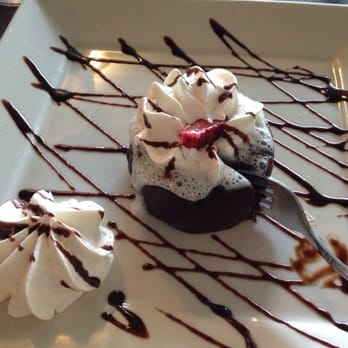Neri's On the Square - Warm chocolate molten lava cake. Real fresh whipped cream - New American Near Me - Graham, Texas Neri's On the Square - Warm chocolate molten lava cake. Real fresh whipped cream - New American Near Me - Graham, Texas