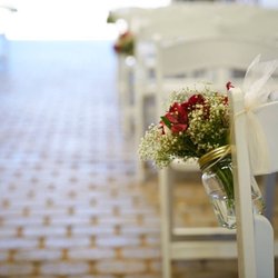 Alicia Horn Weddings - Barn ceremony aisle decorated with simple, elegant floral arrangement
