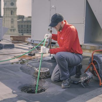 Zoom Drain - Technician power jetting stack lines from the roof of a commercial building. Stack, Snake, Roof, Drains - Plumbing Near Me - Bear, Delaware