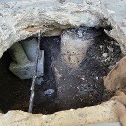 Brown Foundation Repair - Failed Brown pier on the right and new pier on the left.