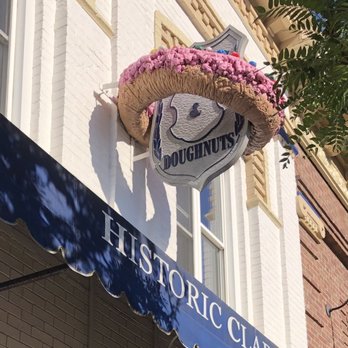 Cops & Doughnuts - Clare City Bakery - Cops & Doughnuts' giant 3-D Doughnut on the front of the bakery. - Bakeries Near Me - Clare, Michigan Cops & Doughnuts - Clare City Bakery - Cops & Doughnuts' giant 3-D Doughnut on the front of the bakery. - Bakeries Near Me - Clare, Michigan