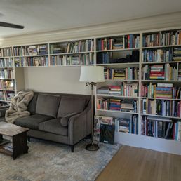 Bookcase built by Rob. It was difficult because the floor isn't level, and we wanted it to surround the sofa. We are SO happy with it.