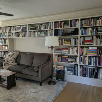 Mt. Tabor Construction - Bookcase built by Rob. It was difficult because the floor isn't level, and we wanted it to surround the sofa. We are SO happy with it. - General Contractors Near Me