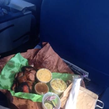 Micklethwait Craft Meats - My meal:  double brisket and kielbasa.  bread, pickles, jalapeño grits and potato salad.  My flight back to NYC was awesome! - Food Trucks Near Me - Austin, Texas