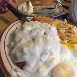 Chicken fried steak and eggs with hash browns and 3pancakes.. Yumm