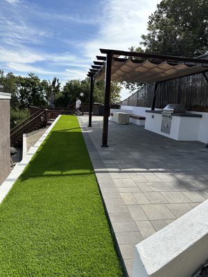 Hillside Backyard Transformation - On this project we had a lot of soil that needed to be removed (as you can see in the last picture).
We built allot of retaining walls to create the pavers area and turf.
We installed outdoor kitchen with stucco finish and concrete countertop.
We matched the same stucco and color on all the retaining walls.
We install Belgard Catalina grana pavers and nice turf.
Pavilion above the kitchen and nice bench next to the fire pit. Hillside Backyard Transformation - On this project we had a lot of soil that needed to be removed (as you can see in the last picture).
We built allot of retaining walls to create the pavers area and turf.
We installed outdoor kitchen with stucco finish and concrete countertop.
We matched the same stucco and color on all the retaining walls.
We install Belgard Catalina grana pavers and nice turf.
Pavilion above the kitchen and nice bench next to the fire pit.