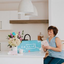 Callia Flowers - Callia bouquet in vase next to delivery box, add-ons and customer