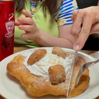 Penny Ann’s Cafe - Penny Ann's Cafe's Scone with a few Penny Puffs and whipped cream on top. - Breakfast & Brunch Near Me - West Bountiful, Utah Penny Ann’s Cafe - Penny Ann's Cafe's Scone with a few Penny Puffs and whipped cream on top. - Breakfast & Brunch Near Me - West Bountiful, Utah