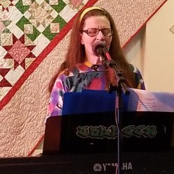 Colleen Kitchen Music - Colleen with Long Hair at the pre-covid Imagine Coffee