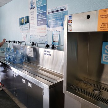 Fresh Alka Water - a man filling up a bottle of water - Water Stores Near Me - San Diego, California Fresh Alka Water - a man filling up a bottle of water - Water Stores Near Me - San Diego, California