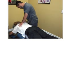 Dr. Peter adjusting a patient