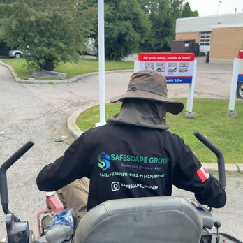Safe Scape Group - Crew working on lawn maintenance/ grass cutting - Snow Removal Near Me