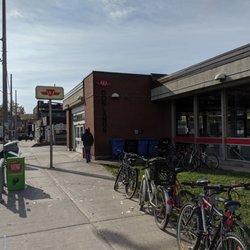 Donlands Subway Station - Station entrance & part of the building from the sidewalk of Donlands with Danforth in the distance. October 2019