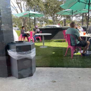 Fresh Kitchen - Outdoor Seating with umbrellas and turf - New American Near Me - Davie, Florida Fresh Kitchen - Outdoor Seating with umbrellas and turf - New American Near Me - Davie, Florida