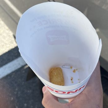 Sonic Drive-In - Staple clearly in bottom of cup with sonic logo. Went to grab last tater tot and saw it - Burgers Near Me - Littleton, Colorado Sonic Drive-In - Staple clearly in bottom of cup with sonic logo. Went to grab last tater tot and saw it - Burgers Near Me - Littleton, Colorado