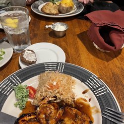 Burbon glazed chicken & shrimp on the first plate and lemon pepper tilapia with twice baked potato.