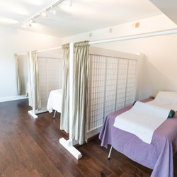 Transformational Acupuncture - View of the three treatment stalls in the lovely East Room (they also have a West Room).