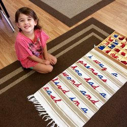 St. Peter's Montessori School - Children practice "writing" with the moveable alphabet to express their thoughts. (Unconventional spelling is common at this stage.)
