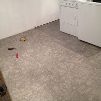 Nasir Flooring - a kitchen with a washer and dryer - Carpet Installation Near Me - Ottawa, Ontario