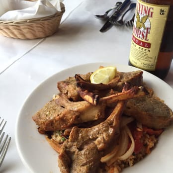 Indian Oven - Spiced, seasoned lamb chops over biryani with onions and red peppers. - Indian Near Me - Columbus, Ohio Indian Oven - Spiced, seasoned lamb chops over biryani with onions and red peppers. - Indian Near Me - Columbus, Ohio