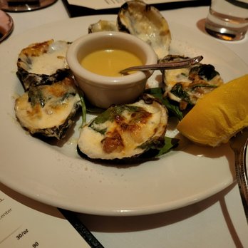 801 Chophouse - Oyster Rockefeller: Bacon, onion, spinach, cream, anisette, and hollandaise. The juice in the oyster is like a delicious soup. - Steakhouses Near Me - Minneapolis, Minnesota 801 Chophouse - Oyster Rockefeller: Bacon, onion, spinach, cream, anisette, and hollandaise. The juice in the oyster is like a delicious soup. - Steakhouses Near Me - Minneapolis, Minnesota