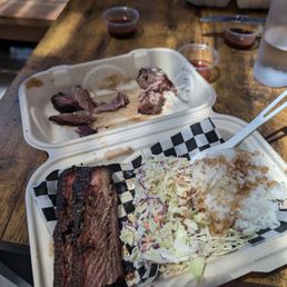 Brisket, coleslaw and salad. Brisket, coleslaw and salad.