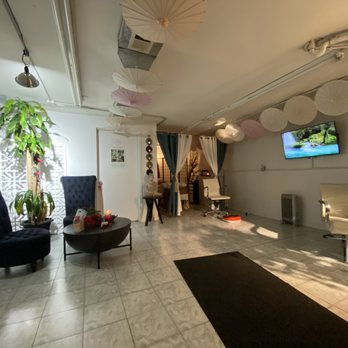 Facials By Martha - Fill out your form in the white chair while enjoying a foot massage (red foot massager on floor). White door leads to room for facial. - Skin Care Near Me - Forest Hills, New York