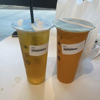 The Alley - Peach Oolong Tea (regular ice, less sugar) and Thai Milk Tea (less sugar, less ice) - Bubble Tea Near Me - Seattle, Washington The Alley - Peach Oolong Tea (regular ice, less sugar) and Thai Milk Tea (less sugar, less ice) - Bubble Tea Near Me - Seattle, Washington
