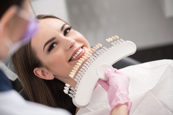 Dental Crowns in 1 Hour by CEREC® - Dental Crown Sacramento – Types of Dental Crowns and Cost. If you need a tooth replacement or simply need to protect an existing weak or damaged tooth, you have options. One of those options is to place a dental crown over your weak tooth. But what exactly is a dental crown?
At Arden Dentistry, we take great pride in offering a wide range of modern materials that closely resemble natural teeth, allowing us to achieve aesthetically pleasing and seamless dental restorations. With our advanced Cerec’s 3D printing technology and streamlined processes, we can complete treatments efficiently, often within just one hour. This cutting-edge approach eliminates the need for temporaries and minimizes the risk of any potential problems, ensuring a smooth and hassle-free experience for our patients. Moreover, our commitment to providing top-quality dental solutions is reflected in our long-term warranty, giving our patients peace of mind knowing they can trust in the durability and longevity of their dental restorations.
WHAT IS A DENTAL CROWN?
Before discussing the types of dental crowns and costs, let’s first explain a dental crown.
Simply put, a dental crown is a cap that looks like a tooth and is placed over an existing tooth.
The primary purpose of a dental crown is to protect and cover your natural tooth. They also sometimes hold a dental bridge in place. Dental crowns are commonly added to teeth after procedures that increase the tooth’s sensitivity, such as a filling or a root canal. Therefore, they are often a temporary solution, although some people have them long-term.
Here are some reasons why you may need a dental crown:
Protecting a weak tooth from breaking.
Restoring a broken or worn natural tooth.
Holding a dental bridge in place.
Covering a misshapen or discolored tooth.
Covering a dental implant.
In short, a dental crown restores your tooth’s strength and appearance. There are many different types of dental crowns and costs. Let’s take a look.
TYPES OF DENTAL CROWNS AND COST
When choosing a dental crown, it’s important to choose the right crown material. Crowns can be made from various materials, including porcelain, metal, or resin.
Porcelain dental crowns are the best crown material to mimic your teeth’s natural look and feel. They are very popular with patients who want to keep the natural appearance of their teeth, especially if the affected tooth is closer to the front of your mouth and is visible when you speak. While there are less expensive options, most patients say a porcelain crown is worth the price. There are also porcelain-metal hybrids that you can consider.
Metal titanium dental crowns are known for their durability and resistance to decay. This makes them the best choice if you’re looking for something long-lasting. Metal crowns are among the most expensive options due to their durability, but this also means that you’ll need to replace them less often.
Resin is the most affordable material for dental crowns. They are made from a dental composite resin and can be color-matched to blend in with the surrounding teeth. That said, they don’t match as well as porcelain and don’t last nearly as long as metal crowns. If you’re looking for a long-term solution, resin’s affordability may not be worth it.
HOW LONG DO DENTAL CROWNS SACRAMENTO LAST
Getting dental crowns isn’t as extensive as other dental procedures. Although the procedure is a single day for some, most of the time, it’s a multi-day process.
A multi-day dental crown process usually requires two or three appointments. Here’s what that looks like:
Your dentist will assess the tooth that needs the crown. This may require them to take a mold of your teeth.
On another day, they will file down part of the outer layer of the tooth to make room for a crown.
Your dentist will take an impression of the filed-down tooth and put a temporary crown overtop while they send the impression to the lab.
Your crown will come in and be cemented onto your tooth.
This process is generally relatively smooth and causes you little to no pain.
DENTAL IMPLANTS VS CROWNS
Dental implants are another option for those looking for an artificial tooth replacement. However, they are a more extensive option.
Dental implants are replacement teeth for your natural teeth that may have fallen out or been extracted.
There are several differences between dental implants and crowns. Some of these key differences include:
Simplicity of the process
Appearance
Cost
Success rate
Amount of time the procedure takes
Here are some of the main differences between dental implants and dental crowns.
The Purpose
A dental crown covers an existing tooth. However, a dental implant replaces an existing tooth that has been extracted or fallen out.
We offer several dental crowns to make it easy to choose what best suits your needs. If you feel like one of your teeth may need a crown procedure, contact Arden Dentistry to book an appointment today. Dental Crowns in 1 Hour by CEREC® - Dental Crown Sacramento – Types of Dental Crowns and Cost. If you need a tooth replacement or simply need to protect an existing weak or damaged tooth, you have options. One of those options is to place a dental crown over your weak tooth. But what exactly is a dental crown?
At Arden Dentistry, we take great pride in offering a wide range of modern materials that closely resemble natural teeth, allowing us to achieve aesthetically pleasing and seamless dental restorations. With our advanced Cerec’s 3D printing technology and streamlined processes, we can complete treatments efficiently, often within just one hour. This cutting-edge approach eliminates the need for temporaries and minimizes the risk of any potential problems, ensuring a smooth and hassle-free experience for our patients. Moreover, our commitment to providing top-quality dental solutions is reflected in our long-term warranty, giving our patients peace of mind knowing they can trust in the durability and longevity of their dental restorations.
WHAT IS A DENTAL CROWN?
Before discussing the types of dental crowns and costs, let’s first explain a dental crown.
Simply put, a dental crown is a cap that looks like a tooth and is placed over an existing tooth.
The primary purpose of a dental crown is to protect and cover your natural tooth. They also sometimes hold a dental bridge in place. Dental crowns are commonly added to teeth after procedures that increase the tooth’s sensitivity, such as a filling or a root canal. Therefore, they are often a temporary solution, although some people have them long-term.
Here are some reasons why you may need a dental crown:
Protecting a weak tooth from breaking.
Restoring a broken or worn natural tooth.
Holding a dental bridge in place.
Covering a misshapen or discolored tooth.
Covering a dental implant.
In short, a dental crown restores your tooth’s strength and appearance. There are many different types of dental crowns and costs. Let’s take a look.
TYPES OF DENTAL CROWNS AND COST
When choosing a dental crown, it’s important to choose the right crown material. Crowns can be made from various materials, including porcelain, metal, or resin.
Porcelain dental crowns are the best crown material to mimic your teeth’s natural look and feel. They are very popular with patients who want to keep the natural appearance of their teeth, especially if the affected tooth is closer to the front of your mouth and is visible when you speak. While there are less expensive options, most patients say a porcelain crown is worth the price. There are also porcelain-metal hybrids that you can consider.
Metal titanium dental crowns are known for their durability and resistance to decay. This makes them the best choice if you’re looking for something long-lasting. Metal crowns are among the most expensive options due to their durability, but this also means that you’ll need to replace them less often.
Resin is the most affordable material for dental crowns. They are made from a dental composite resin and can be color-matched to blend in with the surrounding teeth. That said, they don’t match as well as porcelain and don’t last nearly as long as metal crowns. If you’re looking for a long-term solution, resin’s affordability may not be worth it.
HOW LONG DO DENTAL CROWNS SACRAMENTO LAST
Getting dental crowns isn’t as extensive as other dental procedures. Although the procedure is a single day for some, most of the time, it’s a multi-day process.
A multi-day dental crown process usually requires two or three appointments. Here’s what that looks like:
Your dentist will assess the tooth that needs the crown. This may require them to take a mold of your teeth.
On another day, they will file down part of the outer layer of the tooth to make room for a crown.
Your dentist will take an impression of the filed-down tooth and put a temporary crown overtop while they send the impression to the lab.
Your crown will come in and be cemented onto your tooth.
This process is generally relatively smooth and causes you little to no pain.
DENTAL IMPLANTS VS CROWNS
Dental implants are another option for those looking for an artificial tooth replacement. However, they are a more extensive option.
Dental implants are replacement teeth for your natural teeth that may have fallen out or been extracted.
There are several differences between dental implants and crowns. Some of these key differences include:
Simplicity of the process
Appearance
Cost
Success rate
Amount of time the procedure takes
Here are some of the main differences between dental implants and dental crowns.
The Purpose
A dental crown covers an existing tooth. However, a dental implant replaces an existing tooth that has been extracted or fallen out.
We offer several dental crowns to make it easy to choose what best suits your needs. If you feel like one of your teeth may need a crown procedure, contact Arden Dentistry to book an appointment today.