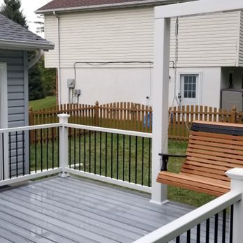 Neiderer's Exteriors - Trex deck and vinyl rail system with custom built in swing with vinyl sleeves for maintenance free care. - Roofing Near Me - Hanover, Pennsylvania Neiderer's Exteriors - Trex deck and vinyl rail system with custom built in swing with vinyl sleeves for maintenance free care. - Roofing Near Me - Hanover, Pennsylvania