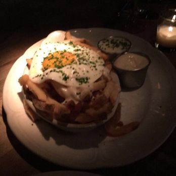Au Cheval - crispy fries with mornay sauce, garlic aioli, and fried farm egg - Bars Near Me - Chicago, Illinois