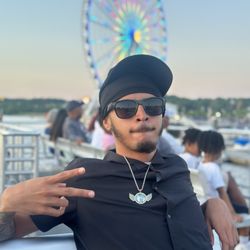 City Cruises Alexandria Water Taxi - My son enjoying his boat ride with the Capital wheel in background