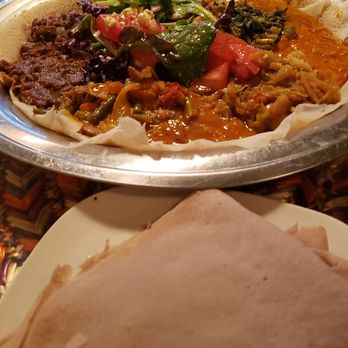 Asmara Restaurant - Ahimilti Bebaynetu (Vegetarian Combination) & Sega Bebaynetu (Meat Combination) with Injera - Ethiopian Near Me - Cambridge, Massachusetts
