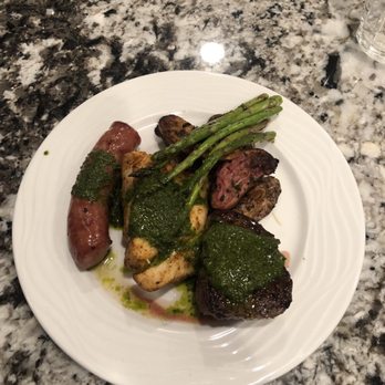 The Dish and The Spoon - Filet medallions, grouper, andouille sausage, with asparagus, fingerling potatoes and Chimichurris sauce - Caterers Near Me The Dish and The Spoon - Filet medallions, grouper, andouille sausage, with asparagus, fingerling potatoes and Chimichurris sauce - Caterers Near Me