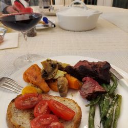 Casey's Market - Steak Florentine served with roasted sweet potatoes,  white potatoes,  green beans, zucchini,  and mushrooms