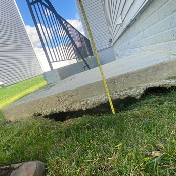 Marrick Properties - Another view of the areaway sinkhole. A full 9" below the top of the landing to the top of the grass. But the sinkhole is another 2" below. - Real Estate Services Near Me - Prince Frederick, Maryland Marrick Properties - Another view of the areaway sinkhole. A full 9" below the top of the landing to the top of the grass. But the sinkhole is another 2" below. - Real Estate Services Near Me - Prince Frederick, Maryland