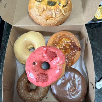 Cruel Donuts - Jalapeño cheese bagel, passion fruit glaze, crème brûlée, blueberry, strawberry glaze, and Boston creme. - Donuts Near Me - San Mateo, California Cruel Donuts - Jalapeño cheese bagel, passion fruit glaze, crème brûlée, blueberry, strawberry glaze, and Boston creme. - Donuts Near Me - San Mateo, California