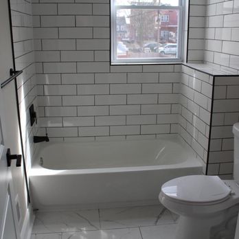 H And H Construction - a bathroom with a toilet and tub - Flooring Near Me - Madras, District of Columbia