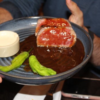 Leonora - The 10oz Wagyu Manhattan is made with shishitos, demi glace, and horseradish aioli. - New American Near Me - Vail, Colorado