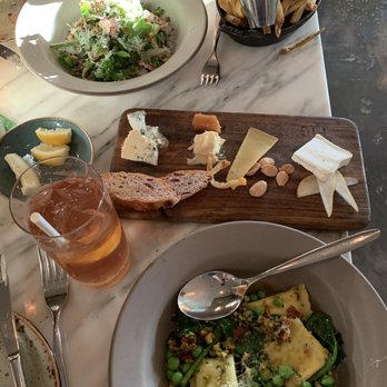 FIG Restaurant - Our tasty spread: spring salad and rosemary fries for her, double ravioli for me, Eric's Stash cheese plate to share - Bars Near Me - Santa Monica, California FIG Restaurant - Our tasty spread: spring salad and rosemary fries for her, double ravioli for me, Eric's Stash cheese plate to share - Bars Near Me - Santa Monica, California