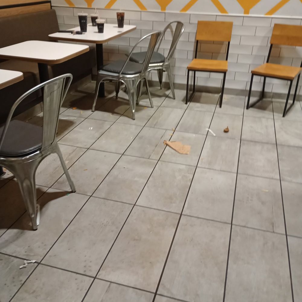 The floor has soda on it and food was left in the floor The floor has soda on it and food was left in the floor
